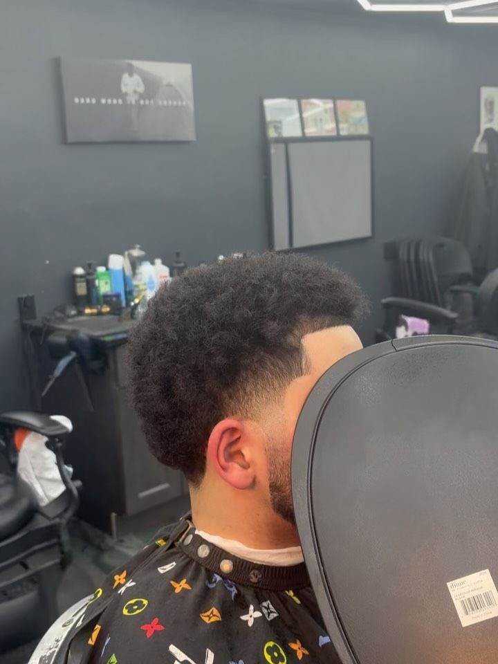 Back view of a curly top with clean, faded sides