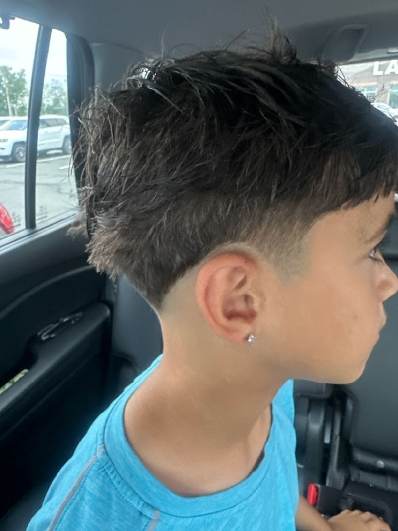 Young client with a fresh taper and messy textured top